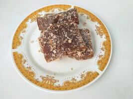 Ongol Ongol, Indonesian Traditional Snacks, made from Arrowroot Flour and Brown Sugar, on white background photo