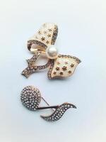 Accessories shaped like butterflies and melodies in yellow and white with imitation gems are suitable for use at events and add to the elegance of women. on white background photo