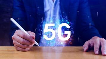 5G network concept, Business using with holographic digital globe with interconnected 5G symbols, 5G technology in modern business and communication, digital transformation. photo