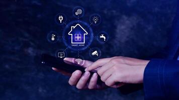 Smart home technology, User touches virtual screen on smartphone manage smart home features including security, lighting, temperature, Smart home and Iot concept. photo