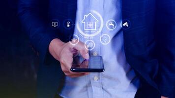 Smart home technology, User touches virtual screen on smartphone manage smart home features including security, lighting, temperature, Smart home and Iot concept. photo
