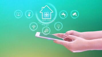 Smart home technology, User touches virtual screen on smartphone manage smart home features including security, lighting, temperature, Smart home and Iot concept. photo