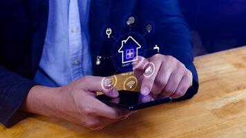Smart home technology, User touches virtual screen on smartphone manage smart home features including security, lighting, temperature, Smart home and Iot concept. photo