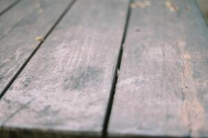 A weathered yet sturdy wooden table structure displays a blend of rustic charm and durability photo