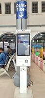 View of the Pasar Senen train station area. Local train and passengers activity. Jakarta, Indonesia - June 8, 2024 photo