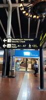 Neon box showing arrows for passengers at terminal 1A Soekarno Hatta Jakarta Indonesia June 11 2024 photo