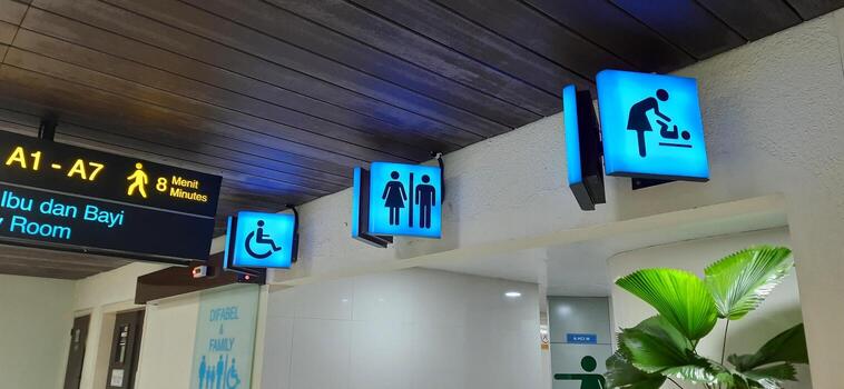 Neon box showing arrows for passengers at terminal 1A Soekarno Hatta Jakarta Indonesia June 11 2024 photo