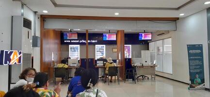 Customer service queue activity for registration of reduced Indonesian train ticket rates for the elderly in the Pasar Senen train station area. Jakarta, Indonesia - June 8, 2024 photo