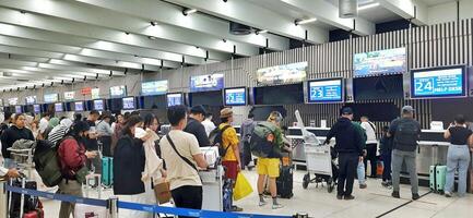 View of passengers activity and interior at terminal 1A Soekarno-Hatta International airport Jakarta, Indonesia - June 11 2024 photo