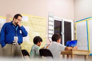Teaching Supervised a two students in a class photo