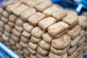 Brown Bandung tofu, ready for sale, showcases its rich color and delicious texture, perfect for adding flavor to any dish photo