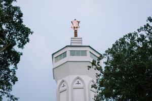 Bogor, Juy 21 2024. The minaret of the Great Mosque of Bogor rises majestically, showcasing intricate architecture and spiritual significance. photo