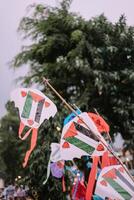 Decorative kites for sale at the city square, showcasing vibrant colors and intricate designs, perfect for adding a touch of whimsy to any da photo