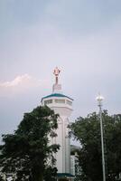 Bogor, Juy 21 2024. The minaret of the Great Mosque of Bogor rises majestically, showcasing intricate architecture and spiritual significance. photo