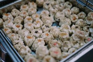 Dim sum served at Bogor city square, offering a delectable selection of bite-sized, steamed delicacies in a lively urban setting photo