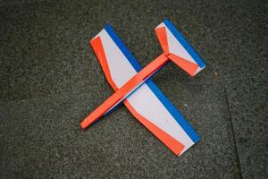 A toy airplane made of foam showcases its lightweight and durable design, perfect for playful and imaginative flight. photo