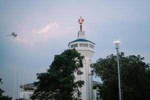 Bogor, Juy 21 2024. The minaret of the Great Mosque of Bogor rises majestically, showcasing intricate architecture and spiritual significance. photo