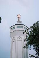 Bogor, Juy 21 2024. The minaret of the Great Mosque of Bogor rises majestically, showcasing intricate architecture and spiritual significance. photo