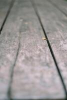 A weathered yet sturdy wooden table structure displays a blend of rustic charm and durability photo
