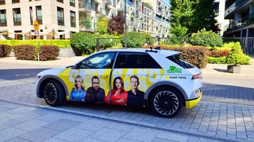 Warsaw, Poland. 9 July 2024. Onet.pl polish web portal logo on Hyundai electric car. Journalists conduct interviews while driving around the city. photo