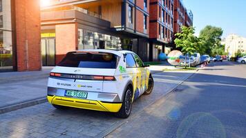 Warsaw, Poland. 9 July 2024. Onet.pl polish web portal logo on Hyundai electric car. Journalists conduct interviews while driving around the city. photo