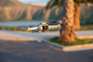 A DJI Mini 3 Pro drone in flight, DJI's new lightweight drone. photo