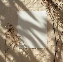 Dried Flower Arrangement With a Blank Card on a Beige Background photo