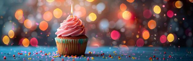 Single Birthday Cupcake With Candle Against Bokeh Lights photo