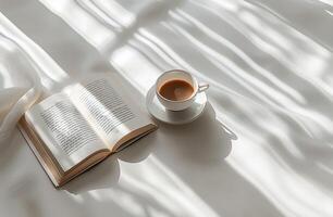 Coffee Cup and Open Book on Window Sill photo