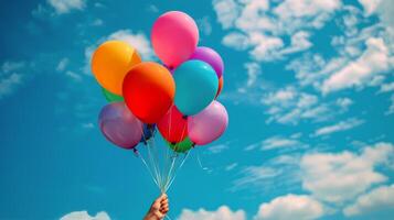 A Bunch of Colorful Balloons Floating in the Air photo