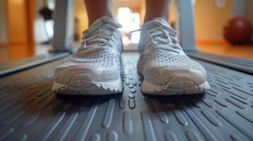 Close-Up of Person Running on Treadmill photo