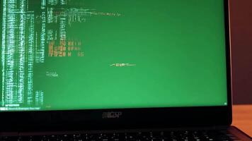 Debugging code on green screen laptop. Replace green screen with error messages. video