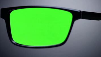 Green screen reflected in computer glasses. Replace green screen with code interface. video