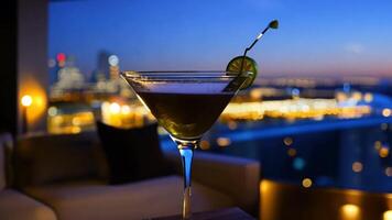 Martini with an olive-green backdrop is replaced by a chic rooftop bar at night. Glittering lights on the city skyline video