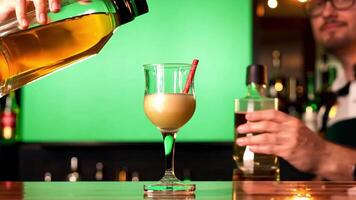 Bartenders are skilled at creating layered shots. backdrop green screen video