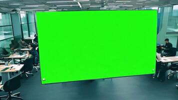 Coworking space with green screen on wall. Replace green screen with animated productivity chart. video