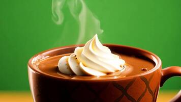 A cup of hot chocolate with whipped cream being served. Green screen backdrop. Warm, soft lighting to create a cozy atmosphere. video