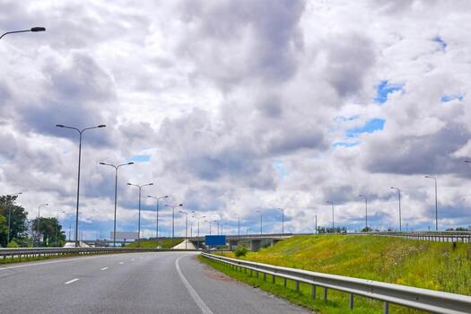 Highway, intersection, car interchange with a bridge on a cloudy day photo