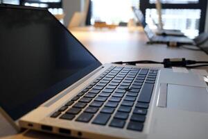 Laptops being prepared and set up for new employees in a company photo