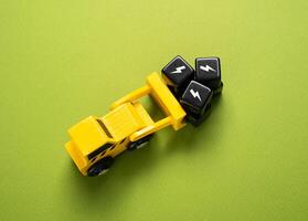 A bulldozer transports black blocks symbolizing threats and failures. Focusing on risk mitigation and recovery strategies. photo