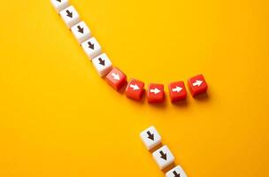 The path of the arrows deviates from the main path. Go off the road, deviate from the course. Take the risk of changing the movement and course of events. photo