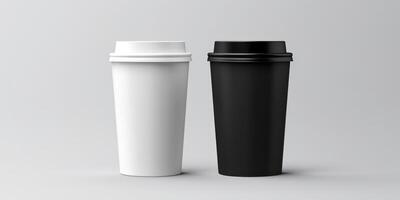 Two Paper To Go Coffee Cups In Black And White. Disposable Unbranded Takeaway Cups. photo