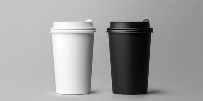 Black and White Paper Cups with Lids on a Grey Background. Disposable Coffee Cups. Recyclable To-Go Utility. photo
