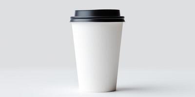 Disposable Coffee Cup with Black Lid on White Surface. Paper Cup for Hot Beverages, Minimalist Design. photo