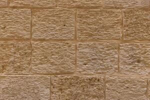 Frontal view of an orange wall with a vintage look photo