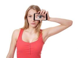 woman holding camera phone to her face photo