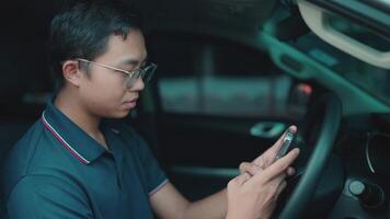 A man sitting in a passenger car can type a message to ask the AI chat system video