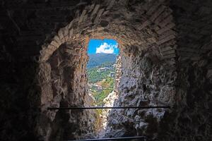 View through a castle window of the small Italian town of Tolfa photo