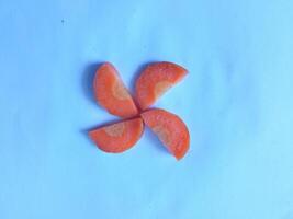 Carrot slices ready to be cooked isolate on white photo