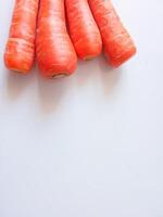 Carrots source of vitamin A isolate on white photo